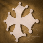 Croix occitane contrastée sur enduit à la chaux